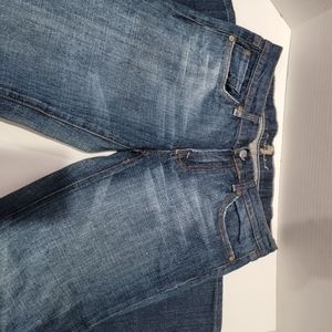 7 for All Mankind Bootcut Jeans feature pink rhinestone design on back pockets